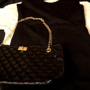 Black fashion purse with a Large size black dress